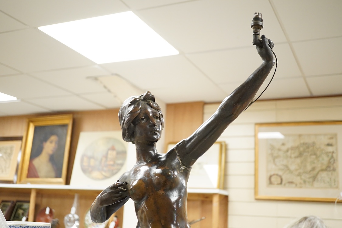 A large bronzed composition figurine of a lady, converted to an electric lamp, 104cm high